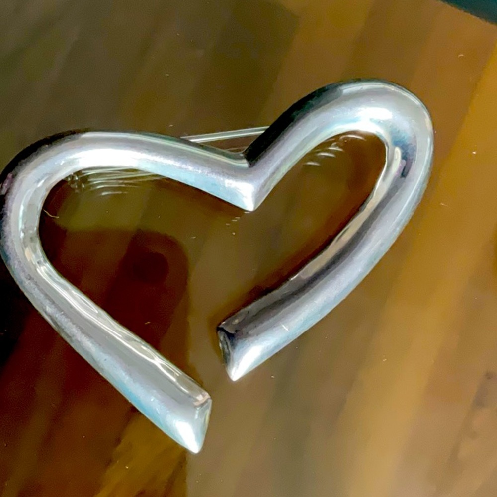 Vintage silver heart shaped pin. Has a silver weight and from Mexico